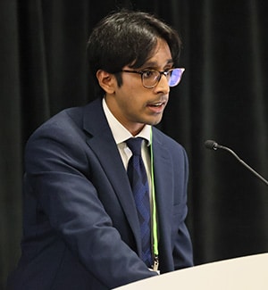 Krishna Dasari speaking at the AACR Annual Meeting 2024 about using AACR Project GENIE data to study lung cancer in smokers vs. nonsmokers.